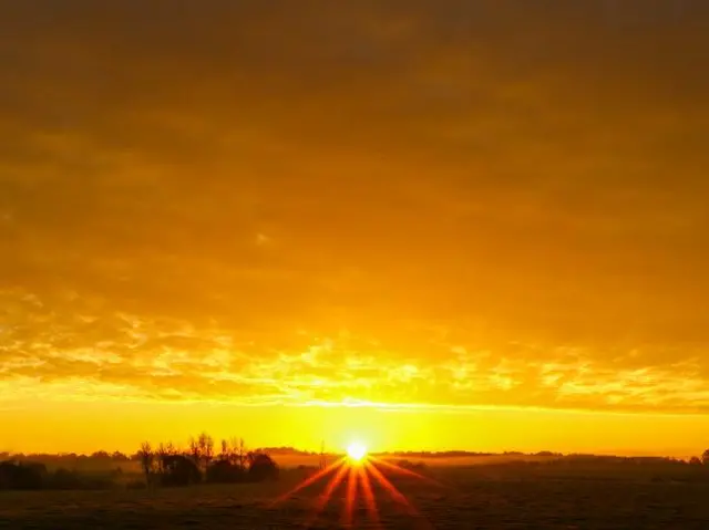 Sunrise over a field