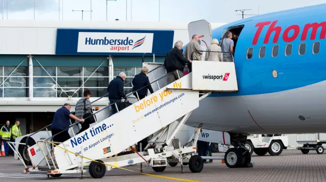 Passengers board a flight at Humberside Airport