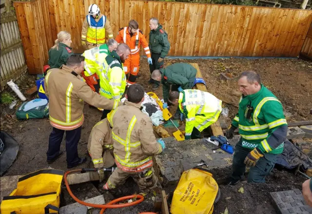 Man under wall at Beamish