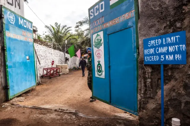 An Indian soldier closes a gate of an Indian Blue Helmets Battalion in Goma on November 8, 2016.