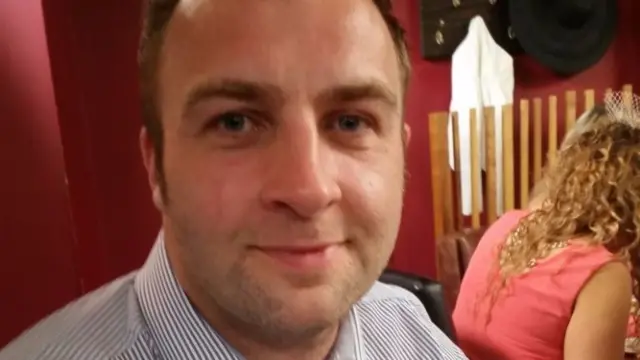 Man facing camera in restaurant