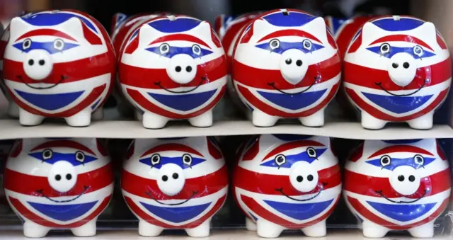 union jack piggy banks on a shelf in a shop in London