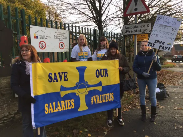 Striking teaching assistants on the picket line outside Villa Real School in Consett, County Durham: