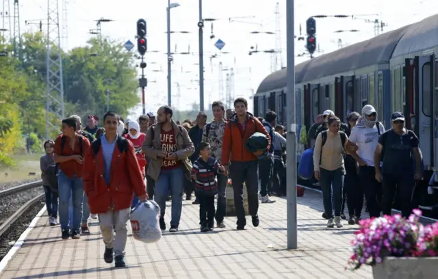 Migrants on a train platform in Hegyeshalom, Hungary