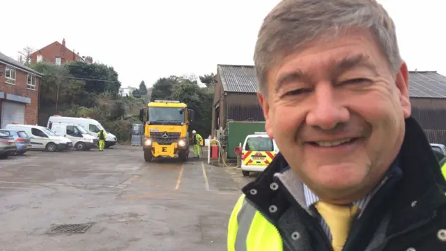 Man standing in front of gritter