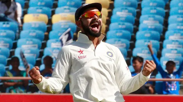 Virat Kohli celebrates