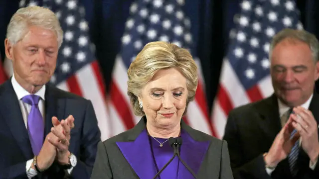 Hillary Clinton, accompanied by her husband former U.S. President Bill Clinton (L) and running mate Senator Tim Kaine, addresses her staff and supporters about the results of the U.S. election at a hotel in New York - November 9, 2016