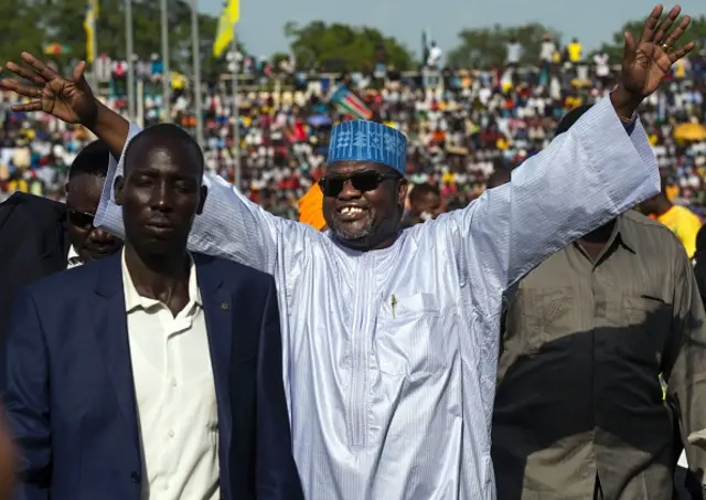 South Sudan's first vice president Riek Machar (C), greets the crowd prior to the Africa Cup of Nations 2017 qualifying football match between South Sudan and Mali on June 4, 2016 at Juba