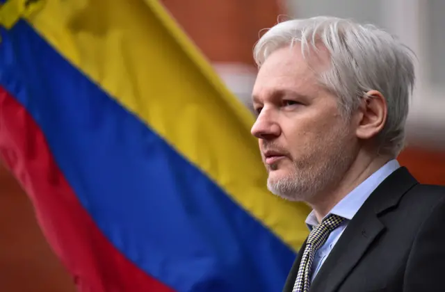 Julian Assange makes a public address from the balcony of the Ecuadorian embassy in London in February