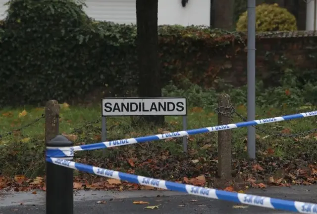 Police tape by Sandilands sign