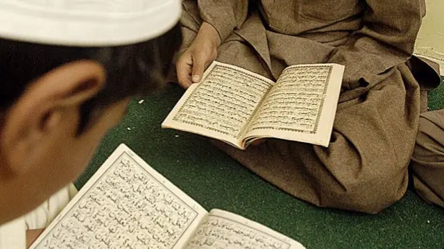 School boys reading the Quran