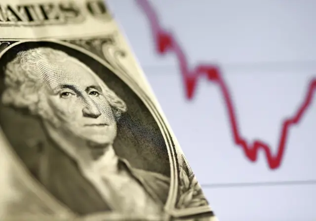 A U.S. dollar note is seen in front of a stock graph in this 7 November 2016 picture illustration.