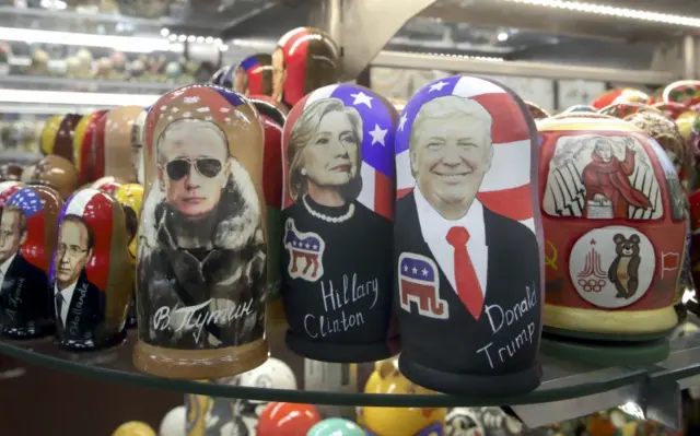 Traditional Russian wooden dolls depicting Putin alongside the candidates