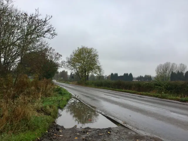 Grey sky and wet road in Long Whatton