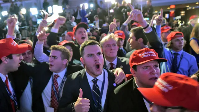 Supporters of Republican presidential nominee Donald Trump reacts to early results during election night at the New York Hilton Midtown in New York - 8 November 2016