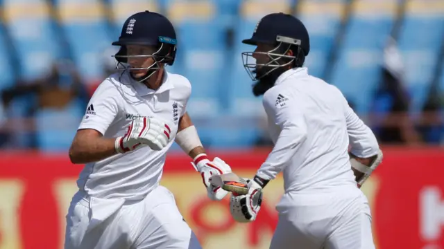 Joe Root left, along with Moeen Ali