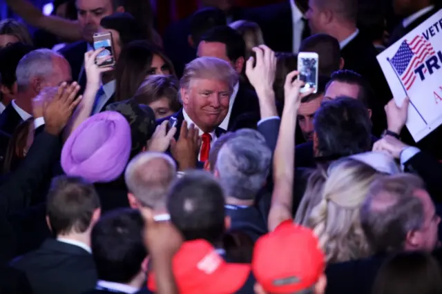 Donald Trump greets people in the crowd after delivering his acceptance speech at the New York Hilton Midtown in the early morning hours of November 9, 2016 in New York City.