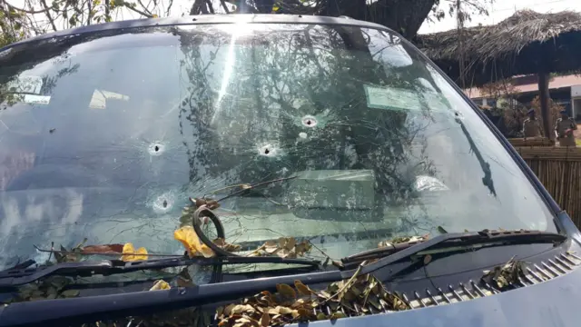 Vehicle with bullet holes in the front windscreen