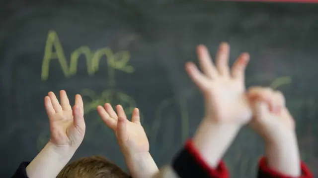 Childrens' hands in classroom