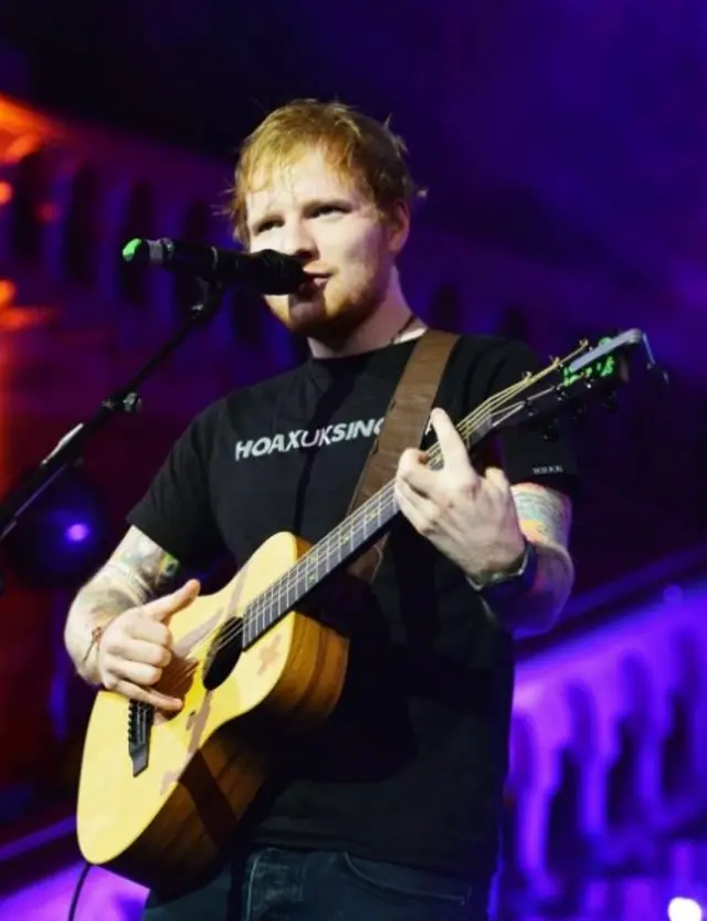 Ed Sheeran on stage, with guitar