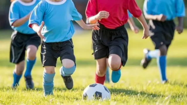 Boys playing football