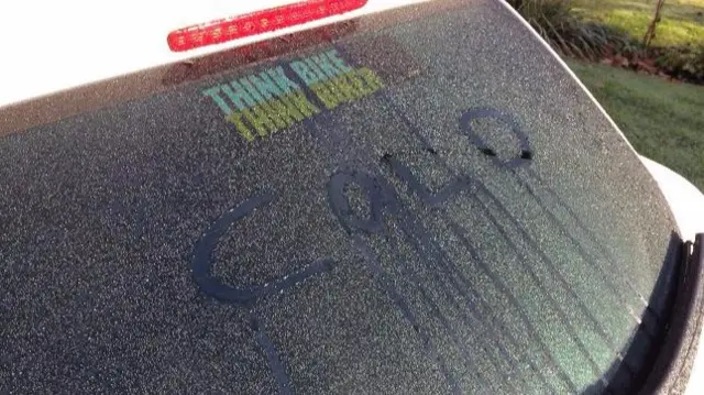 Cold written in condensation on car