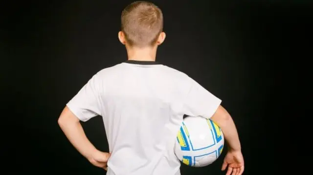 Child with football