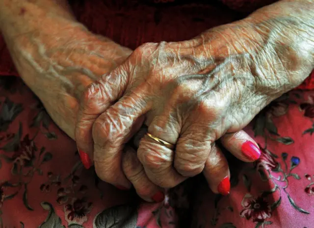 Hands of an elderly woman