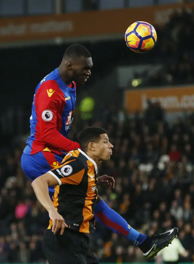 Benteke in action with Hull's Davies