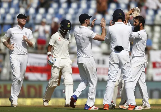 England celebrate their one wicket