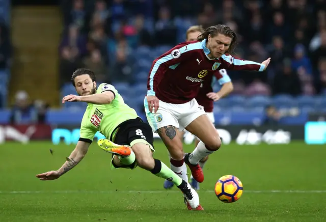 Harry Arter tackles Jeff Hendrick.