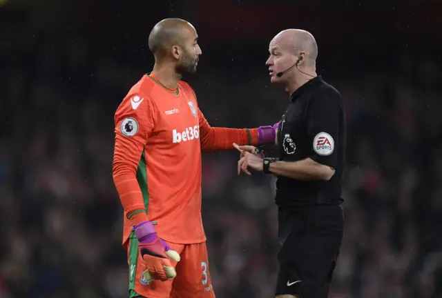 Lee Grant speaks with referee Lee Mason