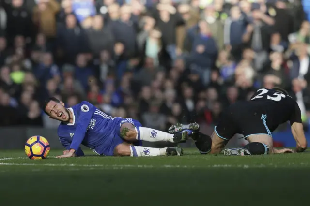 Gareth McAuley fouls Eden Hazard