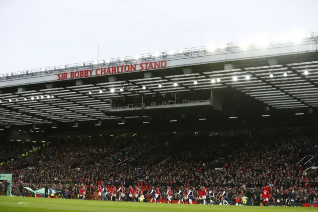 The players walk out at Old Trafford