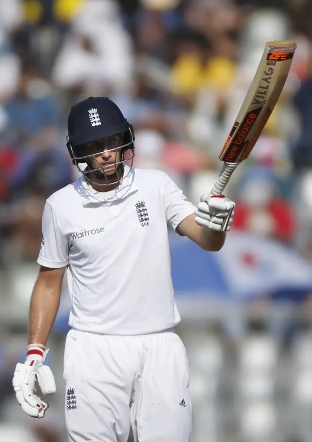 Joe Root raises his bat