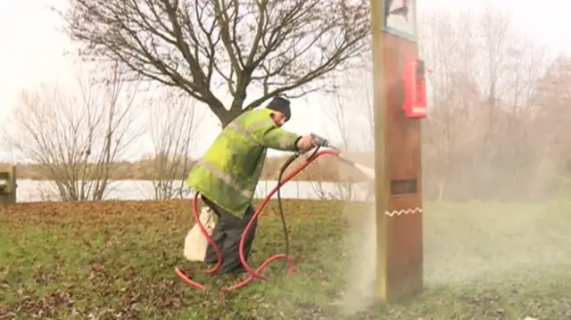 Man clears graffiti