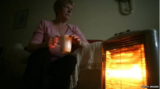 Old lady by fire