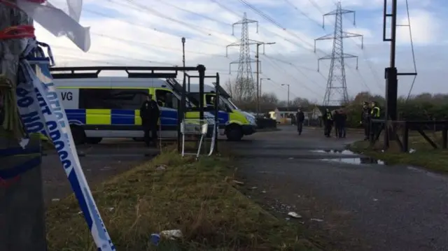Police vehicles at caravan site