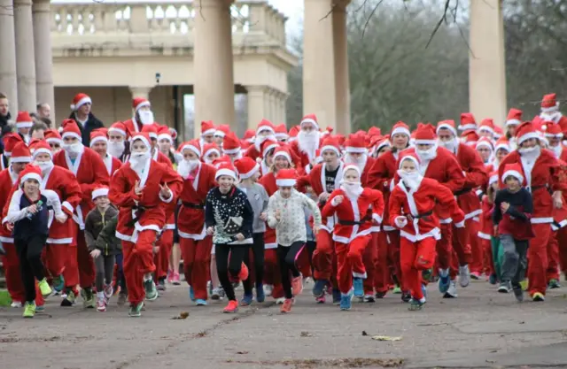 Festive revellers dressed as Father Christmas set off for the run