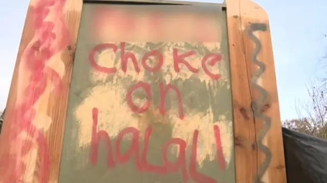 Offensive graffiti on an information board