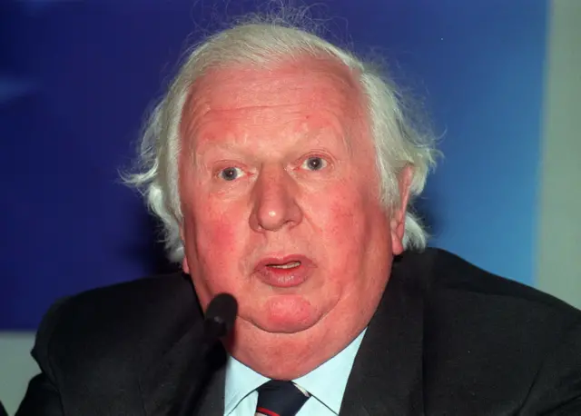 Lord James Prior, in dark suit and striped tie, in 1999