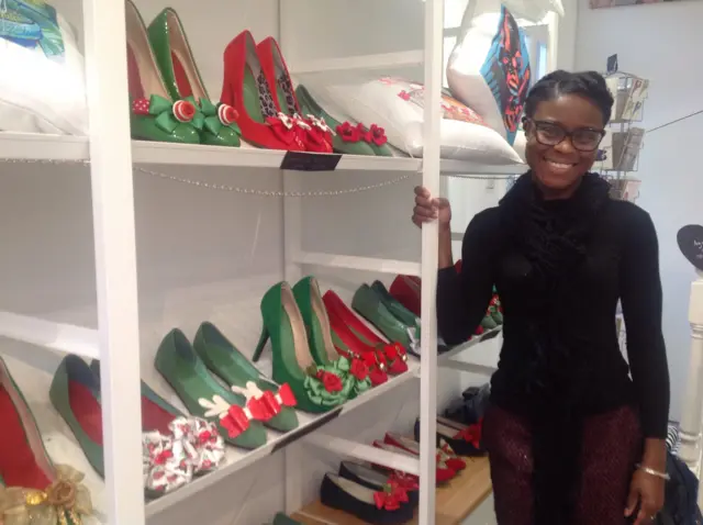 A display of red and green shoes, with Milly J