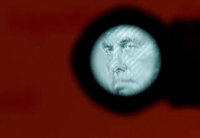 Exxon Mobil CEO Rex Tillerson is seen through the viewfinder of a television camera