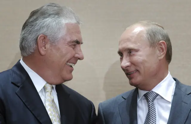 Russian Prime Minister Vladimir Putin, right, and Rex Tillerson, ExxonMobil"s chief executive.