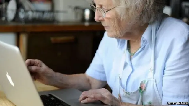 Elderly lady on a Mac