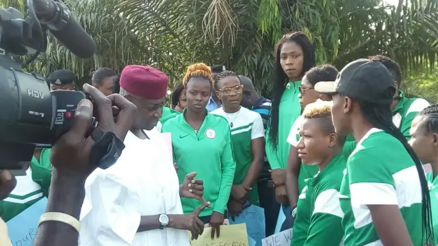 Mr Kyari speaks to the players who are led by their captain Rita Chikwelu