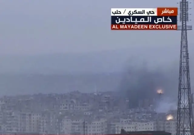 Screengrab from video provided by Al Mayadeen TV showing flames and smoke rising from eastern Aleppo (14 December 2016)