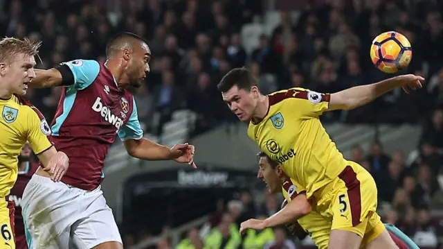 The ball comes off Michael Keane