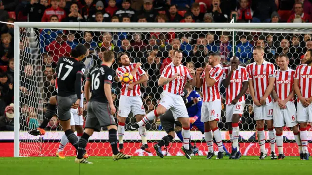 Virgil van Dijk takes a free kick