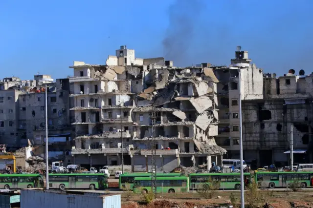 Buses wait to evacuate people from rebel-held eastern Aleppo (15 December 2016)